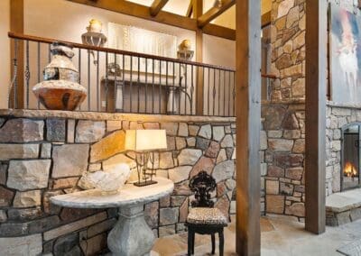 Interior of Vail Ski Home featuring stone wall