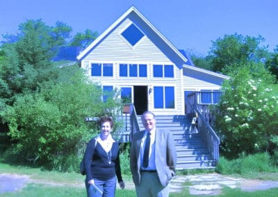 Two people standing in front of the Aldo Leopold Nature Center