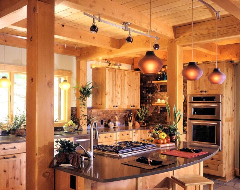 post and beam kitchen with glass pendant lights