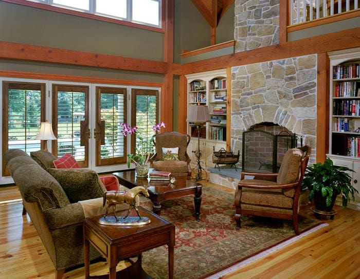 post and beam farmhouse great room with green walls