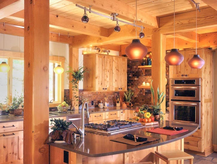 post and beam kitchen with orange glass pendant lights
