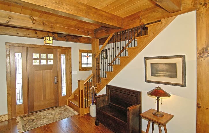 barn home foyer with post and beam frame