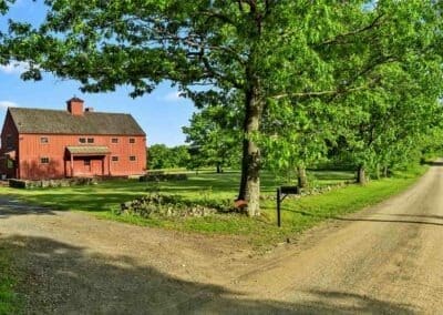 Old barn on a dirt road.