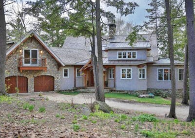 The Lassen (T00408) exterior view featuring stone facade of garage