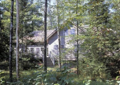 Exterior view obscured by trees