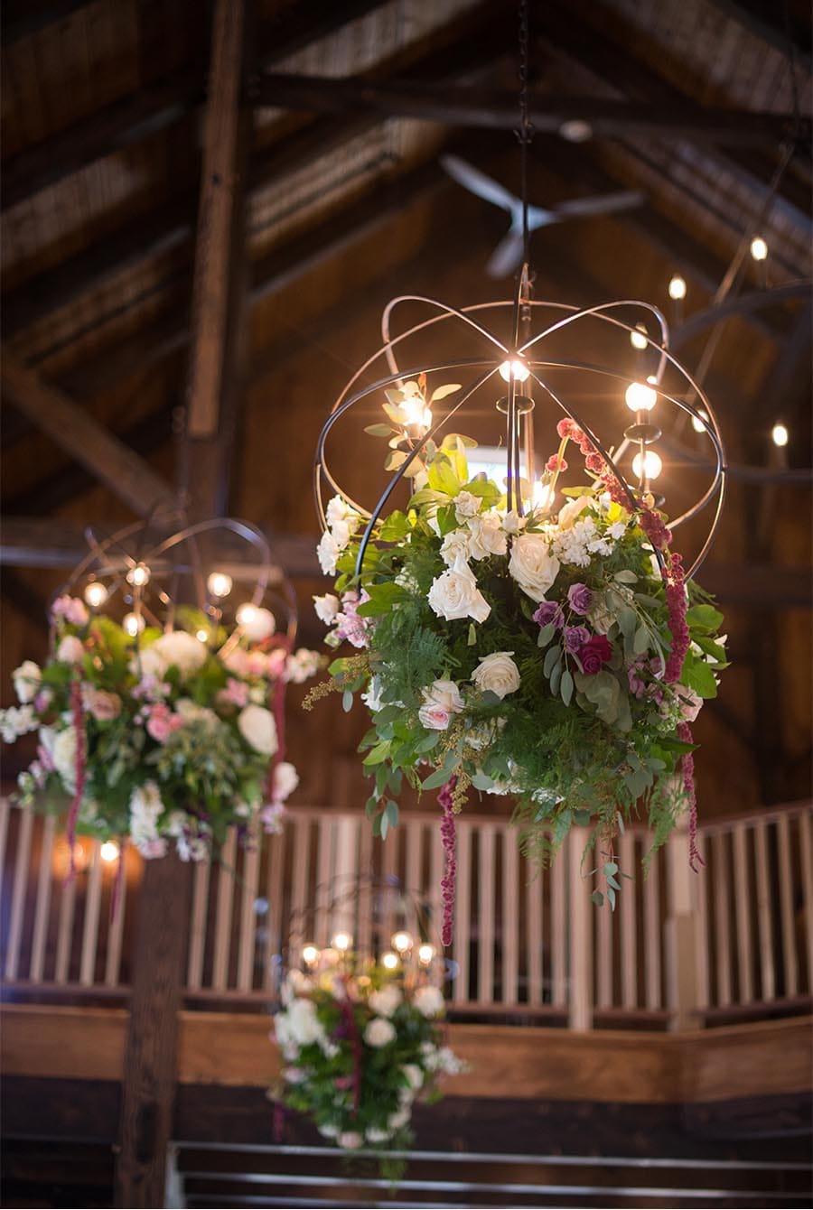 Detail shot showing metal spherical lighting decorated with flowers