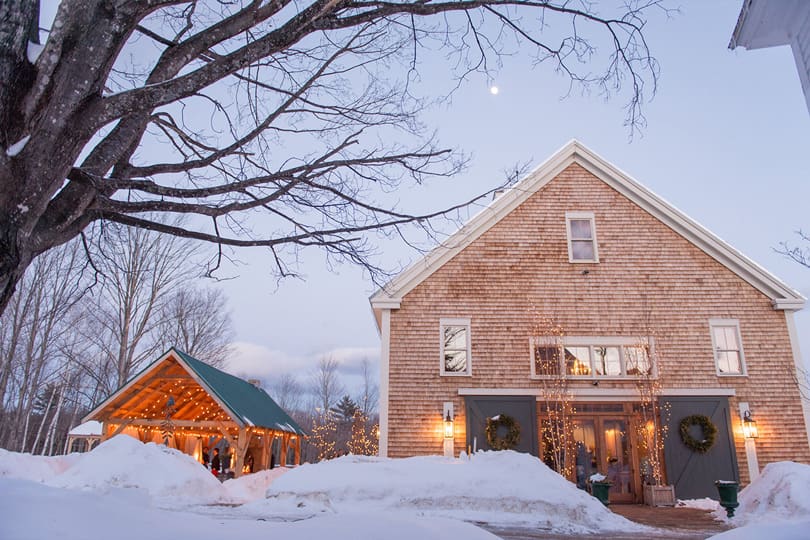 Exterior view of wedding barn in snow