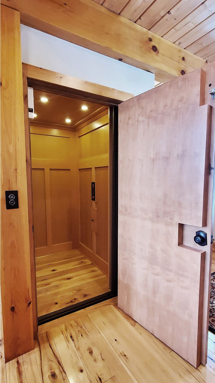 View into wooden paneled elevator.